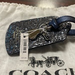 Coach suitcase tag. Never used . Brand new.